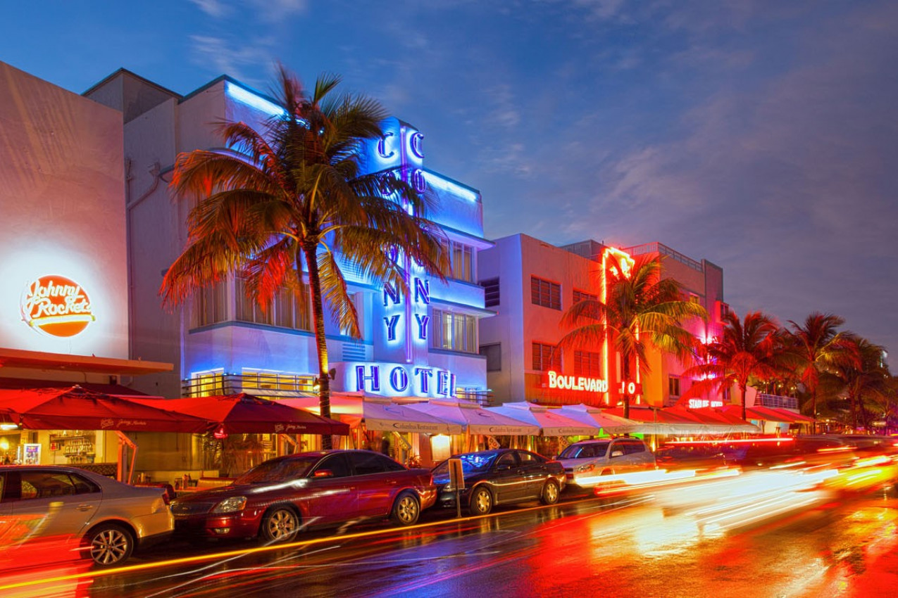 Illuminated hotels and restaurants at sunset on Ocean Drive on April 5, 2013, world famous destination for nightlife, beautiful weather and pristine beaches